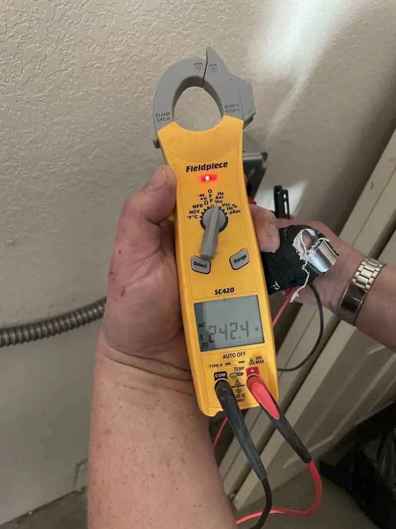 Voltage testing with clamp meter during Whole House Surge Protector in Okemah